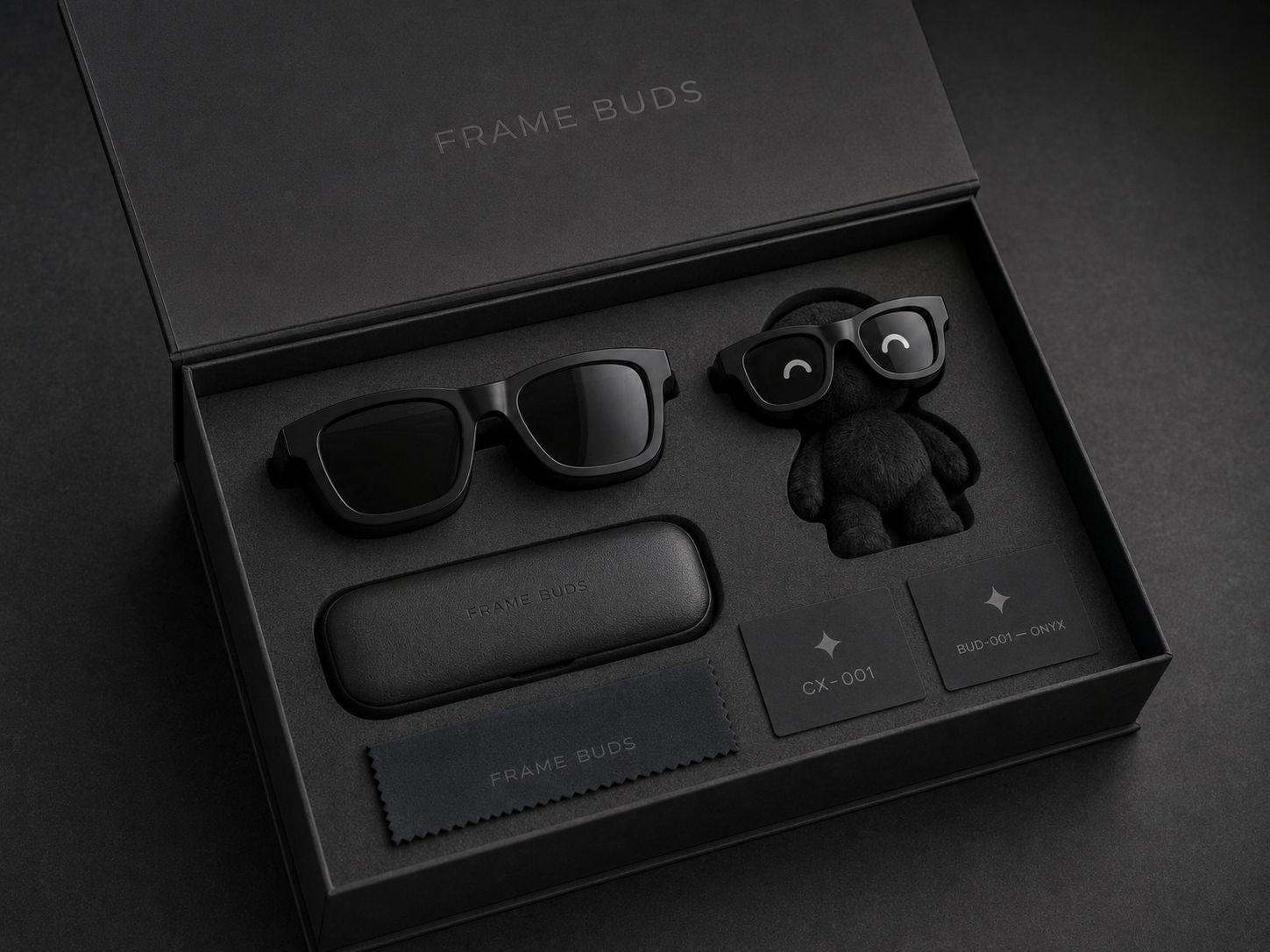 FrameBuds Drop 001 packaging — sunglasses, plush Bud, case, and signal cards